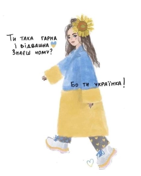 Дівчина-українка з соняшником у волоссі і платтям в кольорах українського прапору